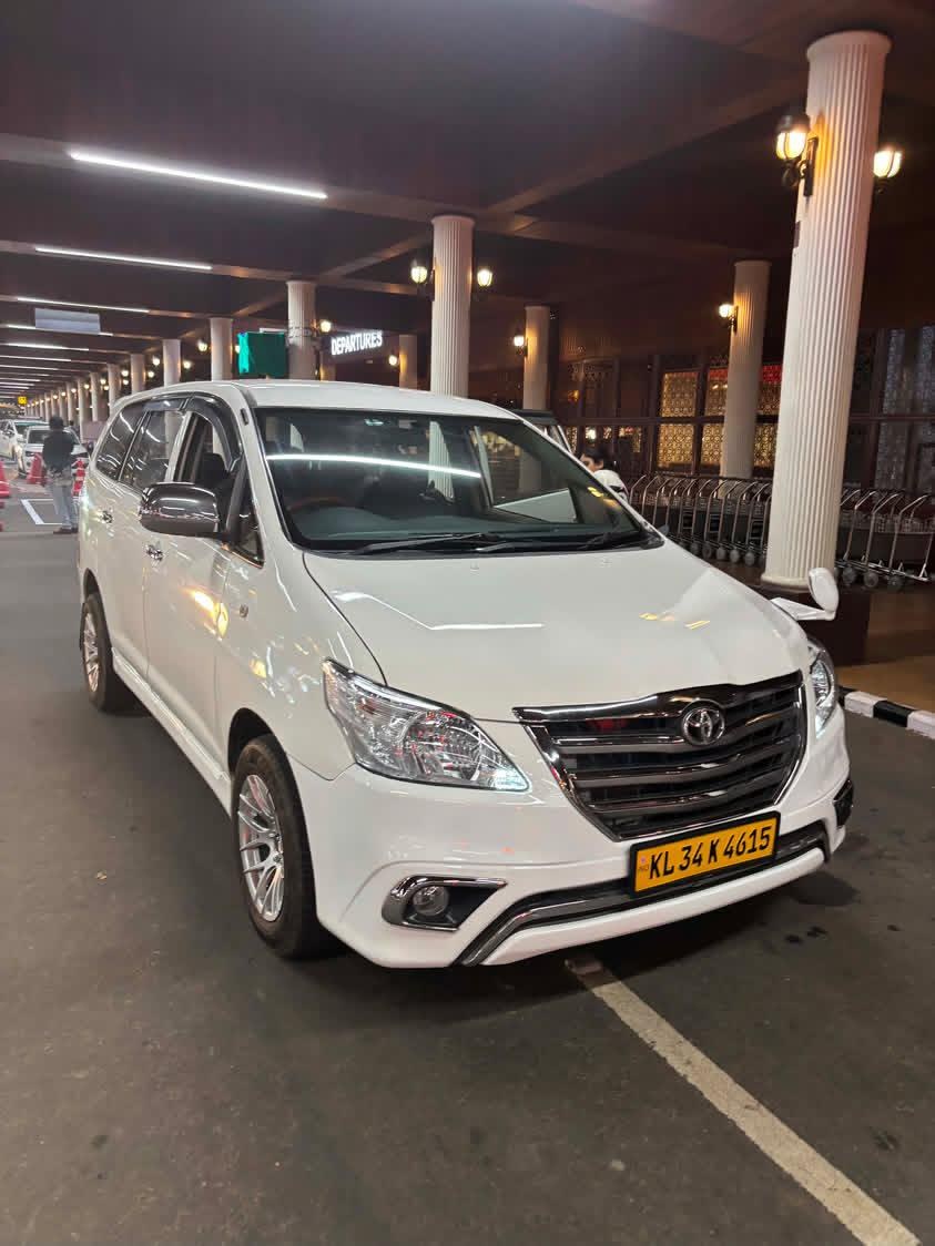 Our white Toyota Innova at the airport