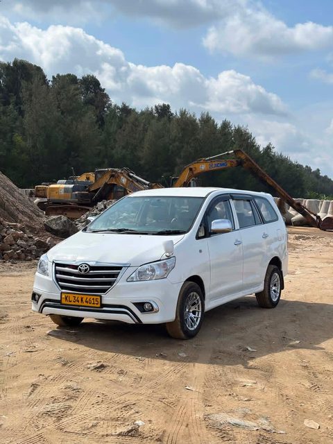 Our white Toyota Innova pickup car in daylight