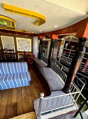 Cushioned seats along the deck rail beside the lounge